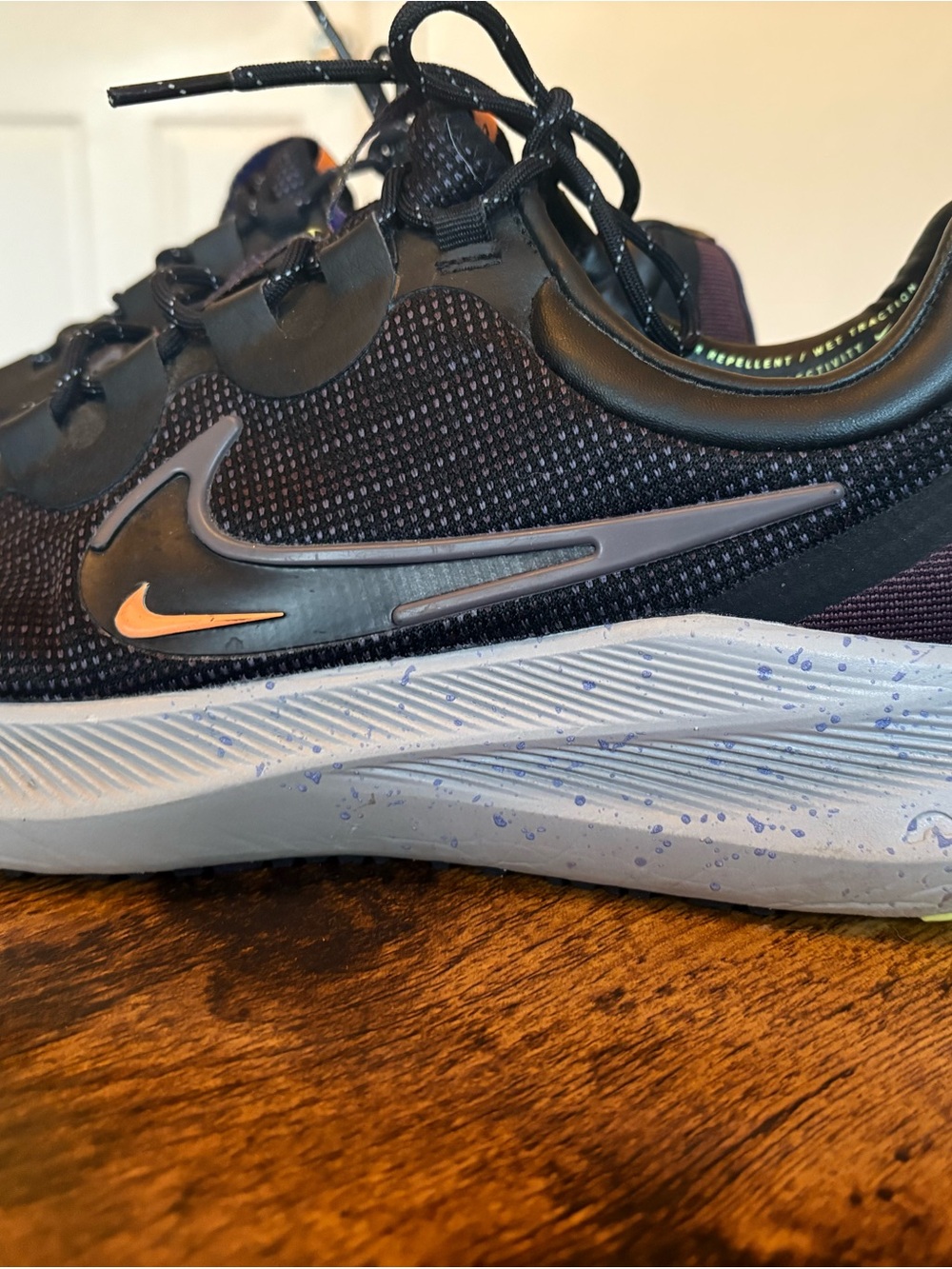 Nike Black Sneakers with Light Grey Sole and Gold Swoosh - Picture 2 of 4
